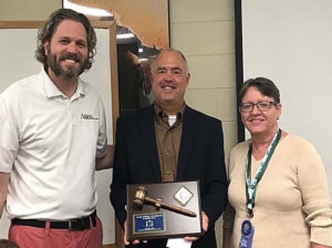 Three people are posing for a picture
